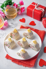 Cream cheese dill ham pinwheel on a plate for Valentine's day holidays