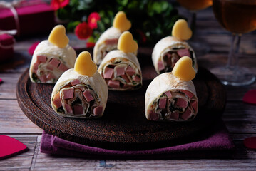 Cream cheese dill ham pinwheel on a plate for Valentine's day holidays