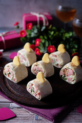 Cream cheese dill ham pinwheel on a plate for Valentine's day holidays