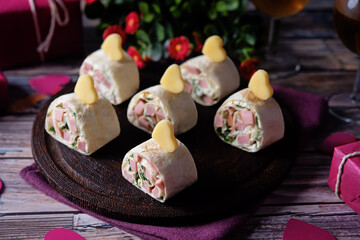 Cream cheese dill ham pinwheel on a plate for Valentine's day holidays