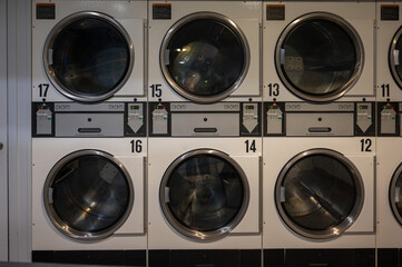Row of washing machines in Public laundromat