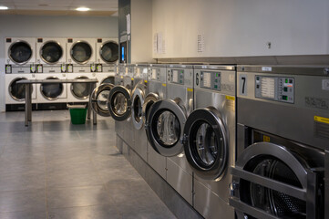 Row of washing machines in Public laundromat