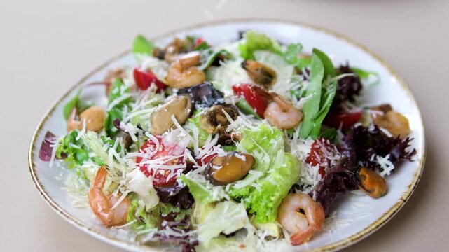 Fried shrimps tempura and fresh salad. sprinkle Parmesan cheese on shrimp salad