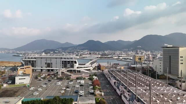 Kitakyushu City, Fukuoka Prefecture, Kyushu, Japan: 4K Aerial Drone Footage of Waterfront Skyline, Urban Districts, High-Rise Buildings, Skylines and Mists Over Mountains