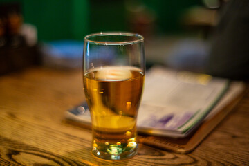Glass of beer in shallow depth of field
