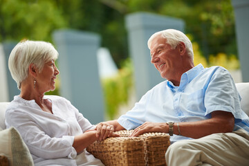 Love, smile or old couple in backyard with connection, conversation or bonding together in retirement. Happy, elderly man or woman outdoor with chat, commitment or relationship trust in home.