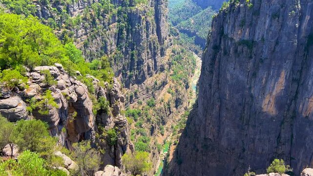 A mountain valley landscape with forests and cliffs. Huge rocks and rocky outcrops. A beautiful deep canyon with lots of tourists. A bird's-eye view of the Tasi Canyon. T&uuml;rkiye	