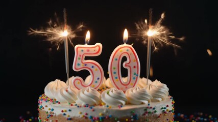Celebratory cake with sparkler and candles for fiftieth birthday or anniversary party, mp4 video. AI