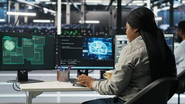Server farm engineering team collaborating to protect against data theft during cyberattack. Data center coworkers rushing to safeguard infrastructure systems during security breach, camera B