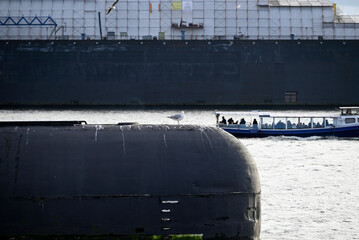 Russian Submarine in the Hamburg Port. Old russian submarine with seagulls at the Hamburg Harbor. Landungsbrücken.