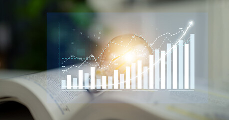 Abstract representation of financial growth through charts overlaid on a book, showcasing data analytics in a study environment for professionals. Impute