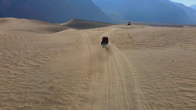 Aerial view of vehicles in Sarfaranga Cold Desert, Pakistan.
