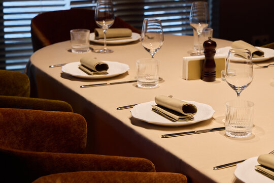 Exquisite table arrangement with delicate napkins and ambient lighting perfect for celebrations