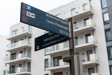 Fototapeta premium Urban street sign with modern buildings