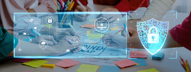 A diverse team engages in a collaborative session focused on secure data protection strategies, using digital tools and colorful notes in a vibrant workspace. Trope