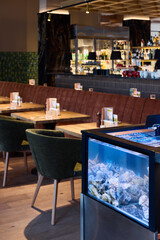 Marinethemed restaurant with coral display, Unique oceaninspired dining area with vibrant coral showcase
