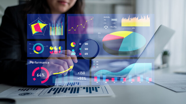 Professional analyzing data insights using digital charts and graphs. Illustrates focused performance review and strategic decision-making in a modern office. Impute
