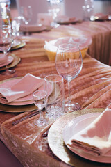 Elegant table setting preparing for holiday celebration dinner
