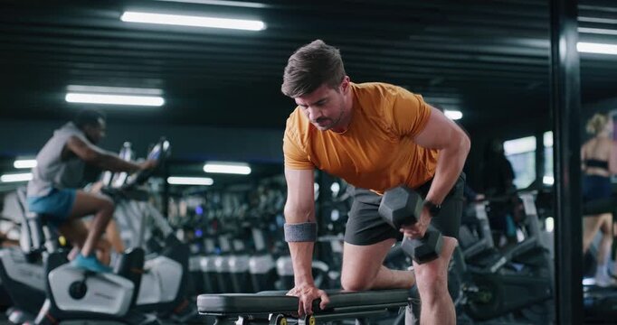 Dumbbell, health and man in gym, fitness and training with endurance, exercise goals and strong. Person, equipment or sports athlete with core strength, workout or challenge with power or bodybuilder