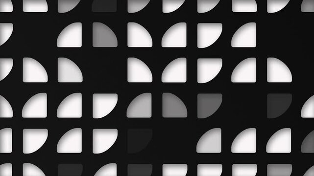 Black and white abstract background with an elegant pattern of quarter circle quadrant cutout shapes. This clean modern design is full HD and a seamless loop.