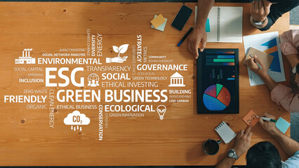 Teams collaborate on green business strategies focused on ESG principles, emphasizing innovation and sustainability in a modern workspace, driving ethical and transparent practices. Amity