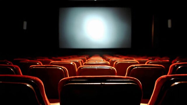 Empty Theater Seats Glow Under Spotlight Before Movie Begins.