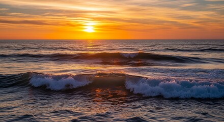 Fototapeta premium Sunset light over ocean waves
