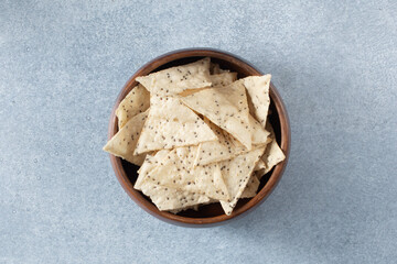 A top down view of a bowl of cassava tortilla chips.