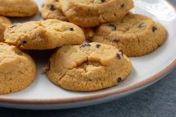 A closeup view of a plate of gluten-free, dairy-free chocolate chip cookies.
