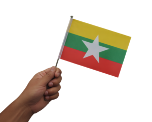 Hand proudly holding Myanmar flag, showcasing patriotism and national pride for independence day celebrations and cultural events