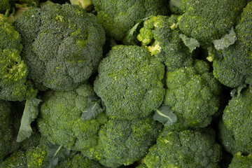 A view of a display of broccoli, as a background.