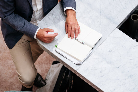 Look up photograph of a notebook of a businessman.