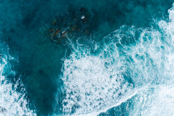 Aerial views over crashing sea waves on rocking ocean crop