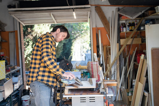 Craftsman Working in a Garage 