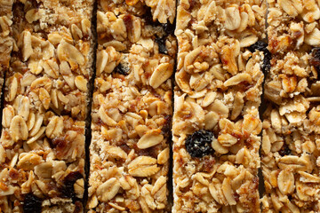A top down view of a layer granola bars, as a background.