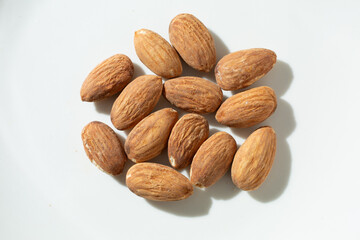 A top down view of a pile of almonds.