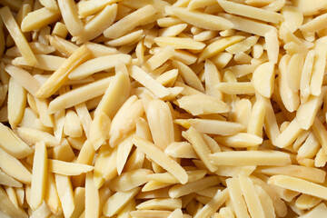 A top down view of a pile of slivered almonds, as a background.