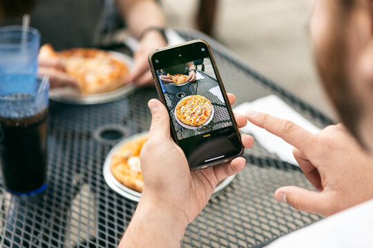 Dining: Man Takes Photo Of Pizza At Lunch