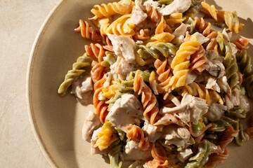 A top down view of a plate of gluten-free chicken pasta salad.