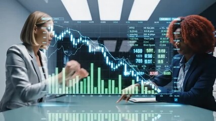 Two businesswomen analyze falling stock market data projected over a conference table - Powered by Adobe