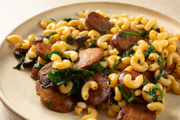 A view of a plate of gluten-free elbows and Spanish chorizo.