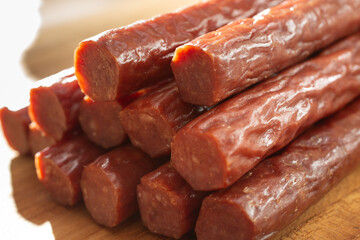 A closeup view of a pile of beef sticks.