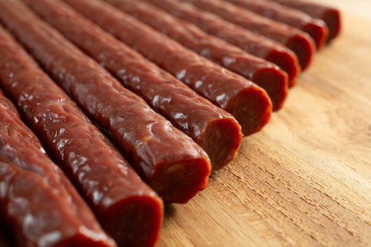 A closeup view of a layer of beef sticks.