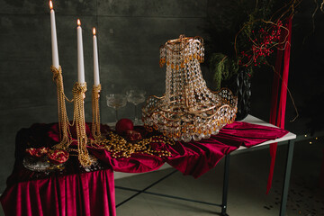 Elegant festive table with crystal ornaments, candles, and decor.