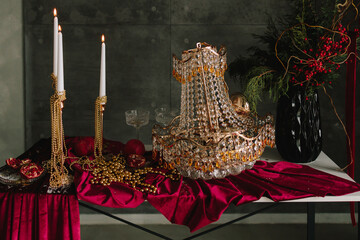 Sparkling Christmas table with glass decorations and candlelight.