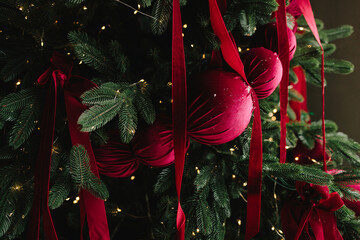 Festive baubles added to Christmas tree.