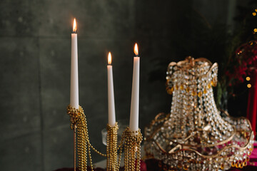 Festive Christmas table featuring crystal, glass, and sparkling candles.