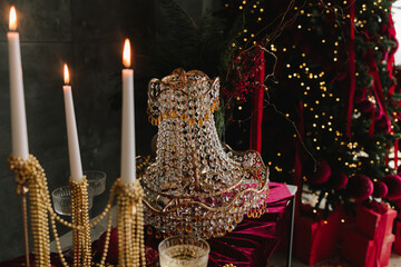 Sparkling champagne glass on Christmas table with crystal ornaments.