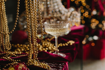 Christmas table setup with sparkling champagne and crystal decor.