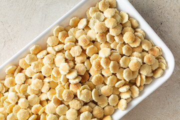 A top down view of a tray of oyster crackers.